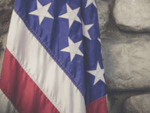 US Flag against stone wall